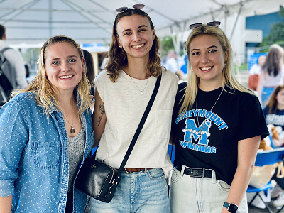 Three women at Marymount University homecoming